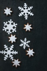Christmas frame Snowflake stencils with flour and xmas cookies ,top view