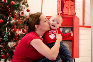 Mother with baby in Christmas time