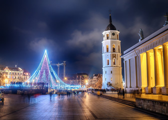 Fototapeta na wymiar Vilnius, Lithuania: Christmas tree and decorations in Cathedral Square, night view