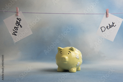 Wages And Debt Timeline With A Piggy Bank Money Box Taken - 