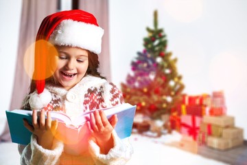 Surprised child opening book.