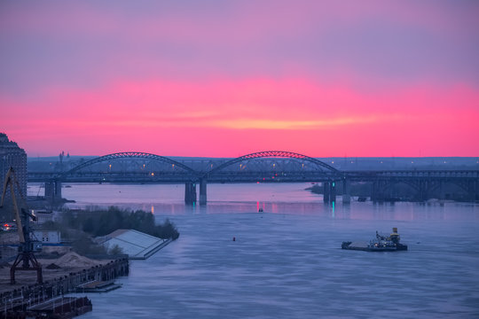 Landscape with the Volga River in Nizhny Novgorod and the bridge against the background of a cloudy sunset sky