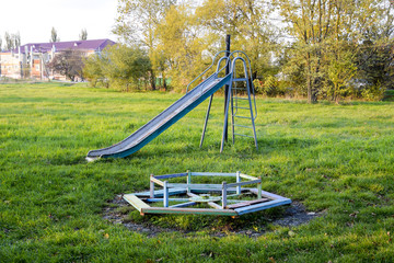 Children playground. Swings and a slide to slide