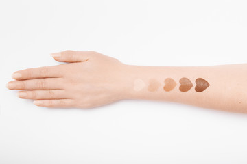 Foundation swatches on woman's hand