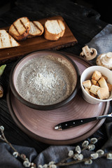 Mushroom cream soup with champignons served with croutons