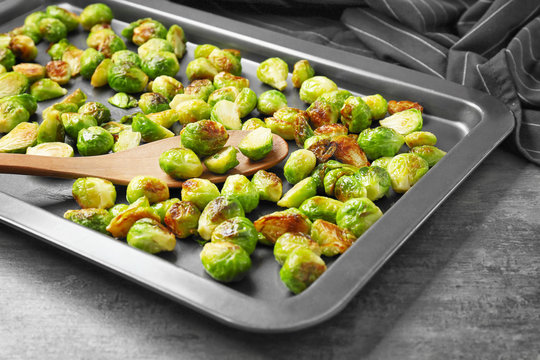 Baking sheet with roasted brussel sprouts on table