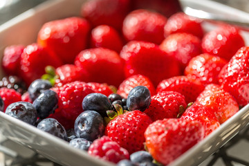 Berries of strawberries and blueberries for breakfast. Close-up.