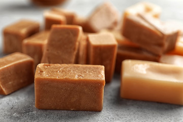 Delicious caramel candies, close up - obrazy, fototapety, plakaty