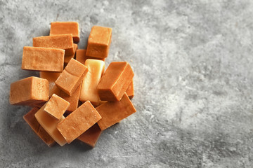 Delicious caramel candies on table