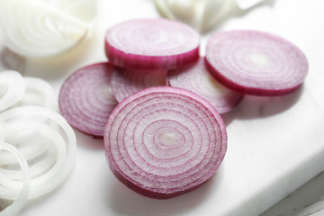 Fresh cut onion on marble board