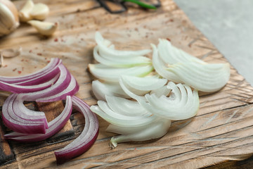 Fresh cut onion on wooden board