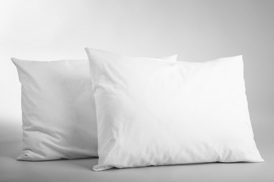Blank soft pillows on light background