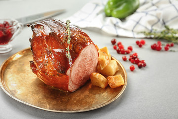 Tray with traditional honey baked ham on table