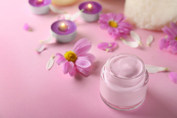 Beautiful composition with jar of body cream on color background