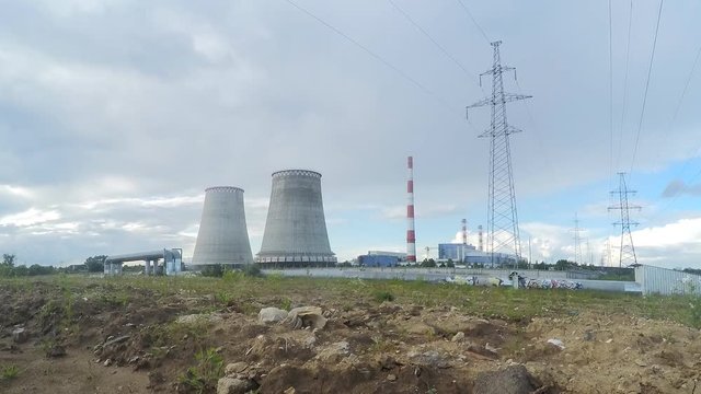 Factory pipes and power towers in summer timelapse