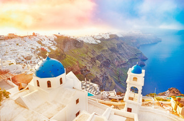 Greece, Santorini, amazing view of famous and very popular Greek travel destination -  Santorini island in Aegean sea in Cyclades group. Breathtaking dawn scenery, blue domes and epic sky scene.