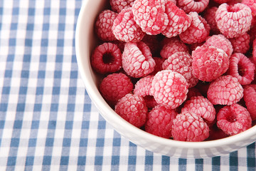 Healthy vegetarian cereal breakfast. Fresh red raspberries.