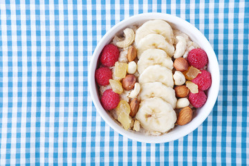 Healthy vegetarian cereal breakfast. Smoothie bowl with berries and nuts.