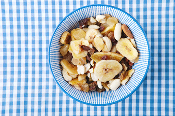 Healthy vegetarian cereal breakfast. Nuts, raisin, fruit and dry fruit pieces.