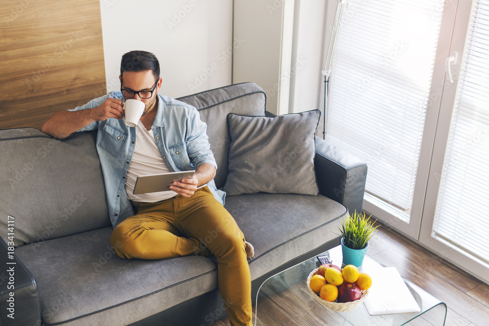 Wall mural drinking coffee at living room