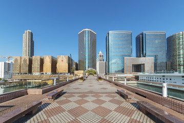 Fototapeta na wymiar modern square with skyline and cityscape background