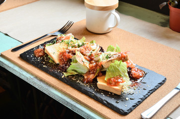  Mexican seafood salad on black slate plate 