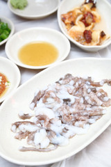 Korean sannakji (Raw Octopus tentacles) meal. Octopuses are often killed before cut into small pieces with tentacles still moving when served.