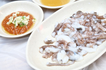 Korean sannakji (Raw Octopus tentacles) meal. Octopuses are often killed before cut into small pieces with tentacles still moving when served.
