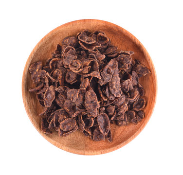 Corn Flakes coated chocolate isolated In a wooden dish on white background.