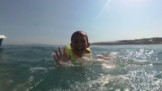 boy on pedal boat pulls off the hill into the sea