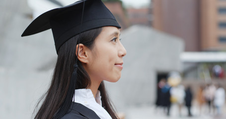 Young asian woman graduation in university campus