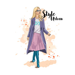 Urban style. Hand drawn sketch. Young stylish woman in the pleated skirt and coat. Vector illustration.