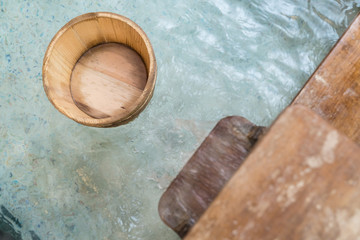 hot springs with wooden barrel scoop