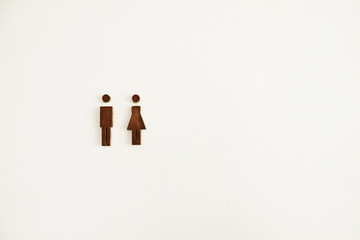 Metal toilet sign for male and female on white background
