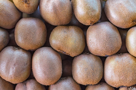 background texture of the folded kiwi fruit on the market counter