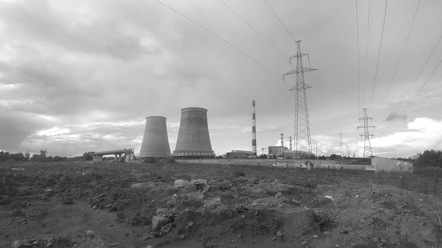 pipes, power towers and clouds black and white timelapse