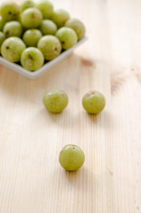 Indian Gooseberry: berry of high vitamin-c on the wooden background
