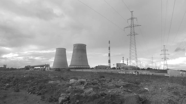 factory pipes, power towers and clouds black and white timelapse