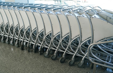 Close up on carts in a row in the airport