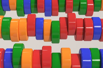 Pattern of blue, red and green cylinder tablets on white background