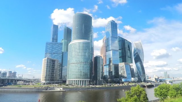 modern towers on the river bank in summer timelapse