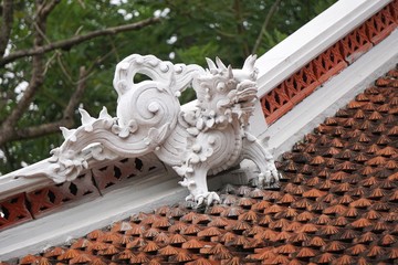 Guardian statue on a temple roof in Vietnam