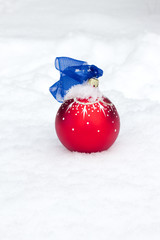 Christmas ball on snow background