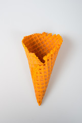 Ice cream cone or empty ice cream cone on background.