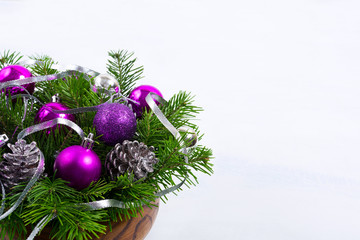 Christmas centerpiece with glitter cones and purple ornaments, copy space.