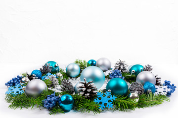Christmas silver, blue, turquoise baubles wreath, copy space.
