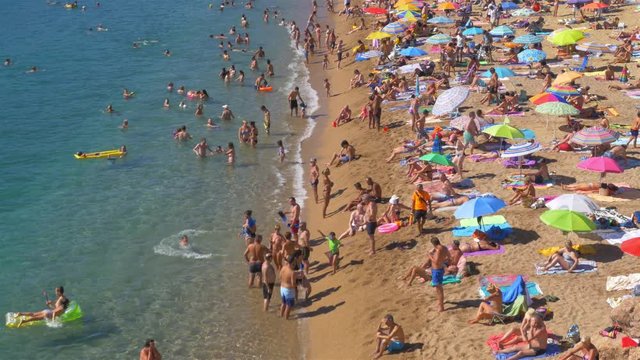 People at the beach in Tossa de Mar, Spain