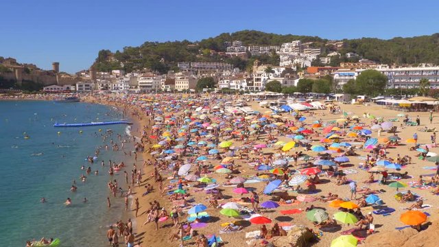 People at the beach in Tossa de Mar, Spain