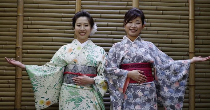 Welcoming Japanese women in kimonos.