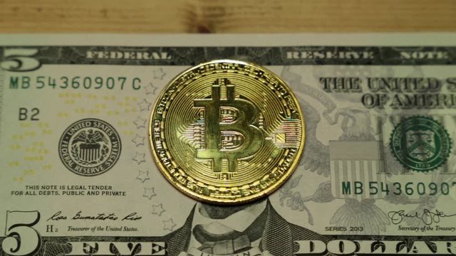 Bitcoins and dollar. US dollar and bitcoin coin.